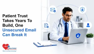Doctor using a laptop with encrypted email icons representing HIPAA-friendly email security in a clinical setting